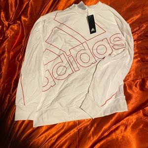 White oversized adidas sweatshirt with pink sleeve stripe